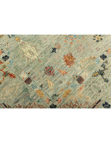 Shahi Fine wool rug from Pakistan. Stylized floral design on an aqua background, vintage effect. Perfect for elegant and traditi