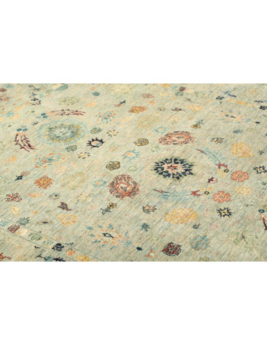 Shahi Fine wool rug from Pakistan. Stylized floral design on an aqua background, vintage effect. Perfect for elegant and traditi