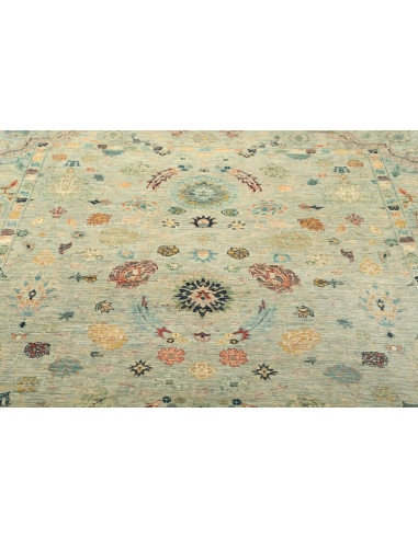 Shahi Fine wool rug from Pakistan. Stylized floral design on an aqua background, vintage effect. Perfect for elegant and traditi