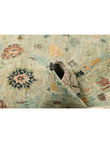 Shahi Fine wool rug from Pakistan. Stylized floral design on an aqua background, vintage effect. Perfect for elegant and traditi