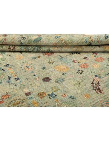 Shahi Fine wool rug from Pakistan. Stylized floral design on an aqua background, vintage effect. Perfect for elegant and traditi