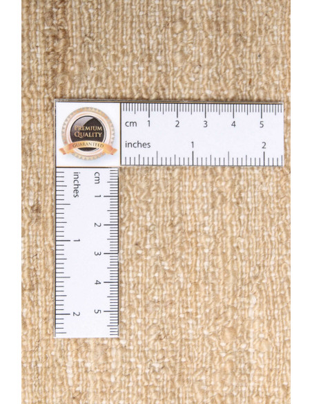 Shayan Pakistani hand-carded wool rug. Geometric black and sand design, vibrant texture. Ideal for modern and minimalist spaces.