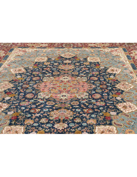 Classic Persian Tabriz 70 Raj rug. Floral central medallion on deep blue field, terracotta red borders. Cork wool and silk, high