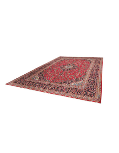Discover the Ardakan Persian rug, a hand-carded wool masterpiece featuring a central medallion and floral design on a red field.