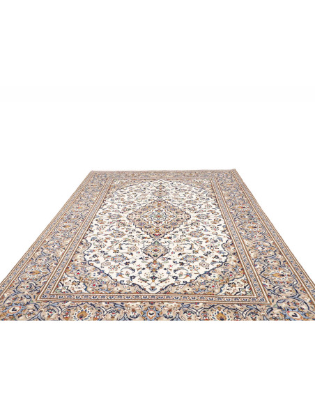 Discover this handmade Persian Kashan wool rug. Classic design with central medallion, floral motifs, cream, beige, and blue col