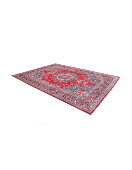 Discover the Persian Sabzevar wool rug, featuring a medallion and rich floral motifs on a red field and blue borders. A textile 