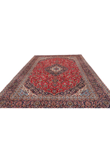 Explore the Persian Ardakan rug: hand-carded wool, floral medallion design on a red field and blue borders. Classic elegance fro