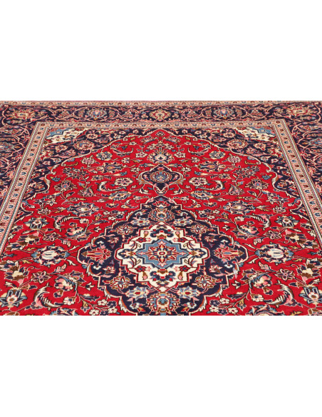 Ardakan Persian rug: a floral masterpiece in red, blue, and ivory. Elegant central medallion design, crafted from hand-carded wo