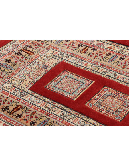 Handmade Persian Nimbaft rug with geometric tribal and stylized floral patterns. Red, beige, and polychrome, made of hand-carded