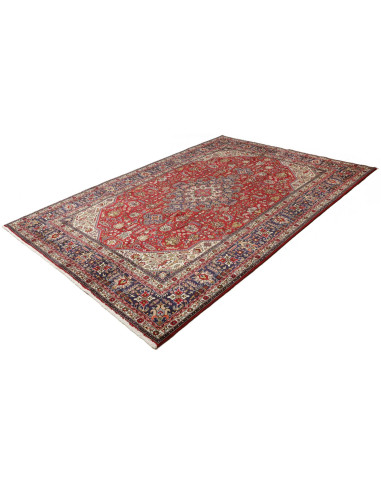 Original Persian Tabriz rug. Central medallion, red field, blue border. Hand-carded wool. Timeless elegance and tradition.