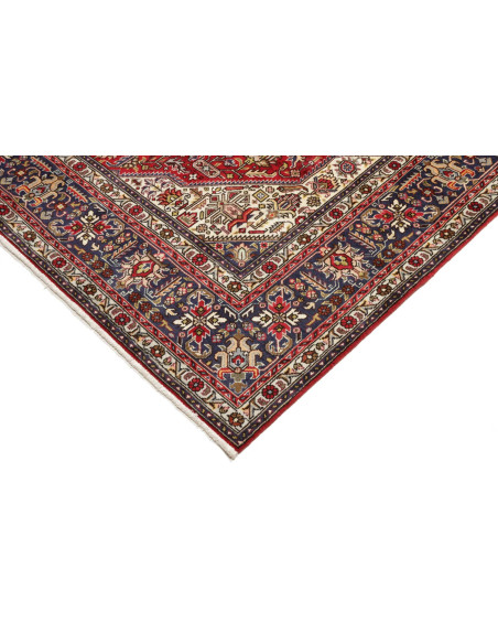 Tappeto persiano Tabriz originale. Medaglione centrale, campo rosso, bordura blu. Lana cardata a mano. Eleganza e tradizione sen
