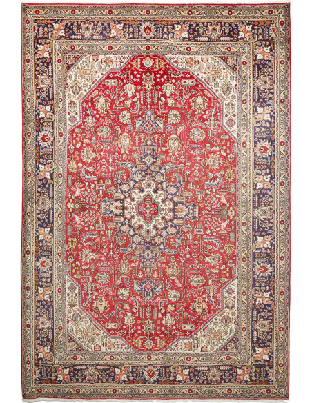 Discover the elegance of this Persian Tabriz rug. Floral medallion on a red field, blue border, and cream details. High-quality 