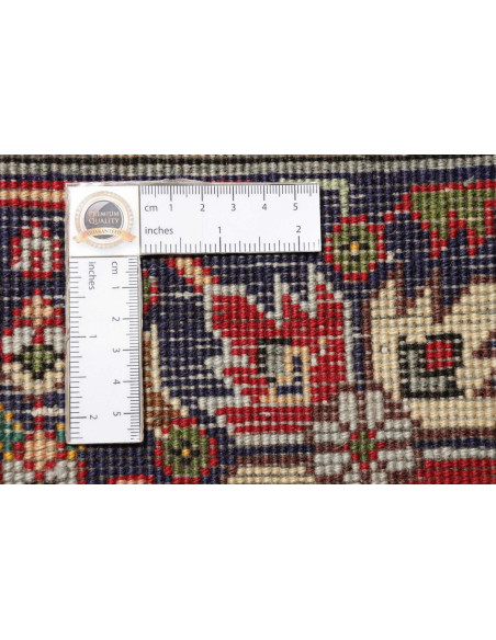 Discover the elegance of this Persian Tabriz rug. Floral medallion on a red field, blue border, and cream details. High-quality 